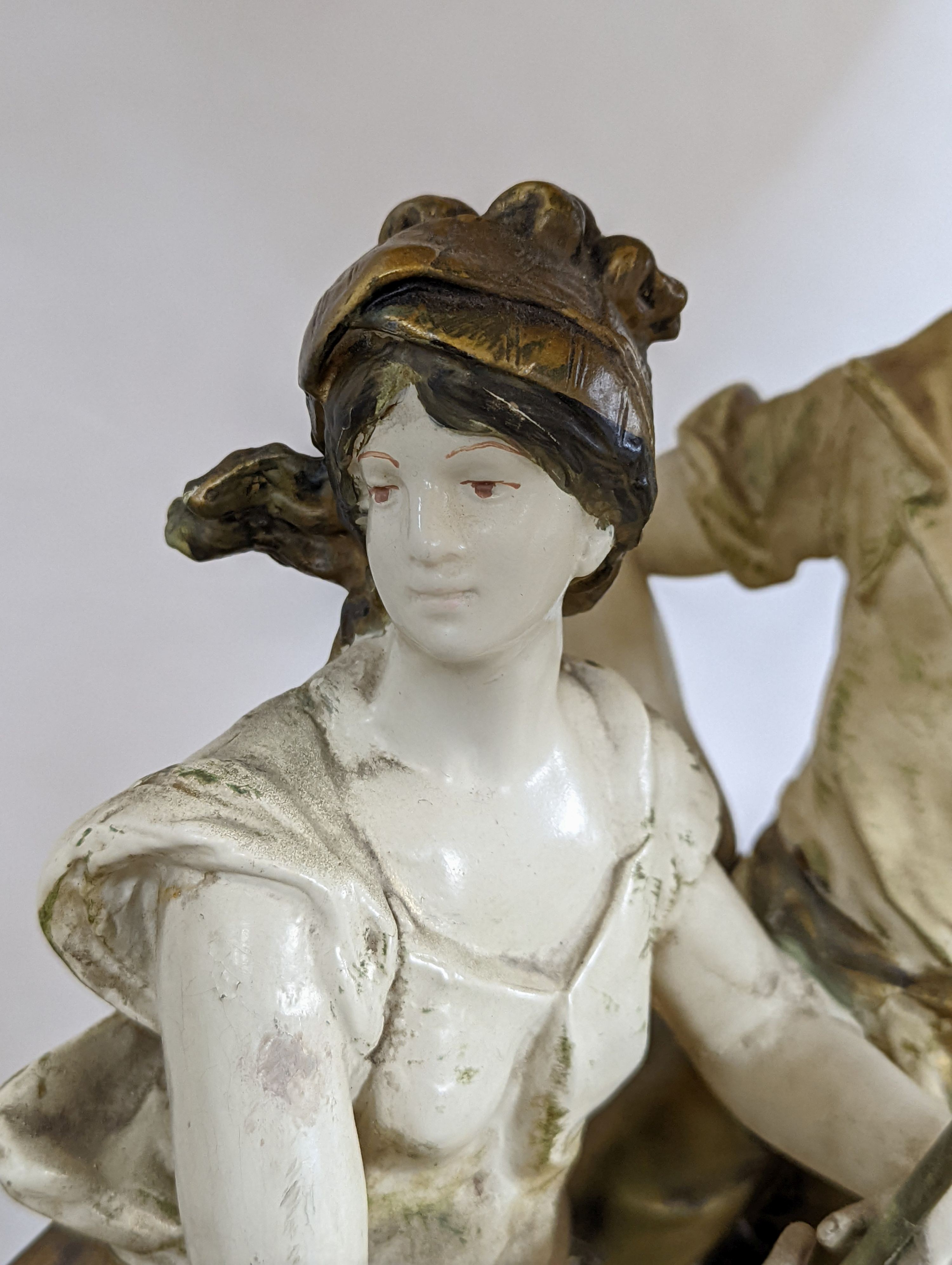 After L & F Moreau - a painted spelter figural table lamp, peasant girl and boy, 96 cms high including shade.